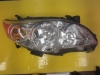 Toyota Corolla  Headlight right side tab on the right side top in missing- OEM